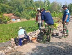 Satgas TMMD 111 Pasang Pondasi Batu Untuk Jalan