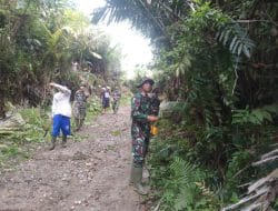 Partisipasi Warga Laksanakan Gotong-royong Perlebar Jalan Desa di TMMD Kodim Tapsel
