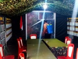 Cegah penyebaran covid 19, satgas TMMD lakukan Penyemprotan Disinfektan Di Pos kotis