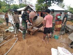 Anggota Satgas Sedang Membuat Adonan Cor Beton